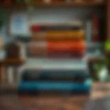 A stack of influential books on a wooden table