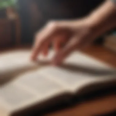 A close-up of a hand turning the page of a classic book