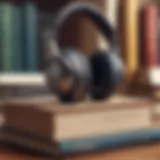 Close-up of headphones resting on a stack of books