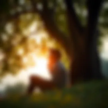 A person contemplating under a tree